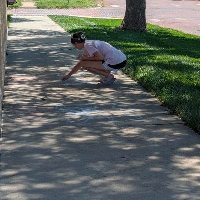 Decorating sidewalks for the first day of school at Central Elementary and Jefferson Intermediate