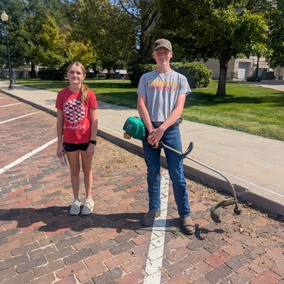 Cleaning up downtown to prepare for the car show